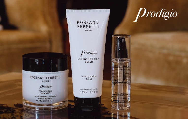 Image of Rossano Ferretti Parma's Prodigio collection with the cleansing scalp scrub, the rejuvenating treatment and the regenerating oil.
