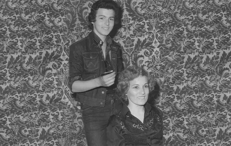 Young Rossano Ferretti styling a customer's hair