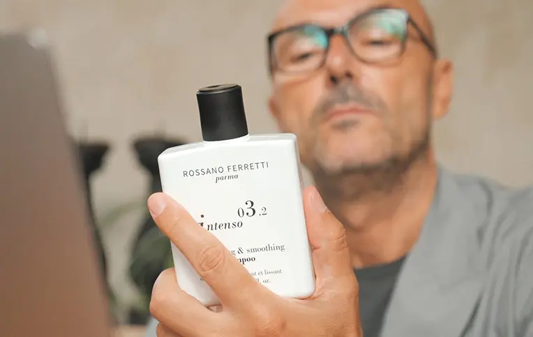 Rossano holding the Intenso Shampoo by Rossano Ferretti Parma