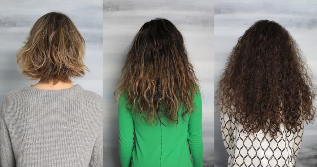 Immagine di tre ragazze di spalle con capelli e colori differenti.