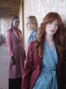 Image of three girls with different hairstyles.