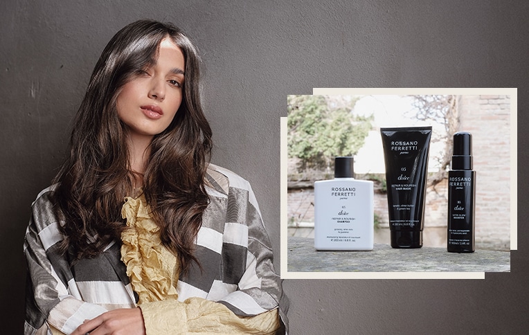 Image of a girl with long, dark hair with the products from the Dolce line by Rossano Ferretti Parma. Shampoo, nourishing conditioner, and the Dolce satin glow booster spray.