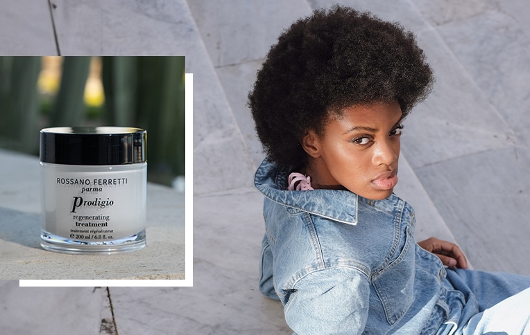 Image of Rossano Ferretti Parma's Prodigio regenerating treatment alongside a girl with dark afro voluminous hair. 