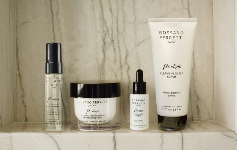 Rossano Ferretti Parma's Prodigio collection with the cleansing scalp scrub, the regenerating treatment, the power drops and the regenerating oil.