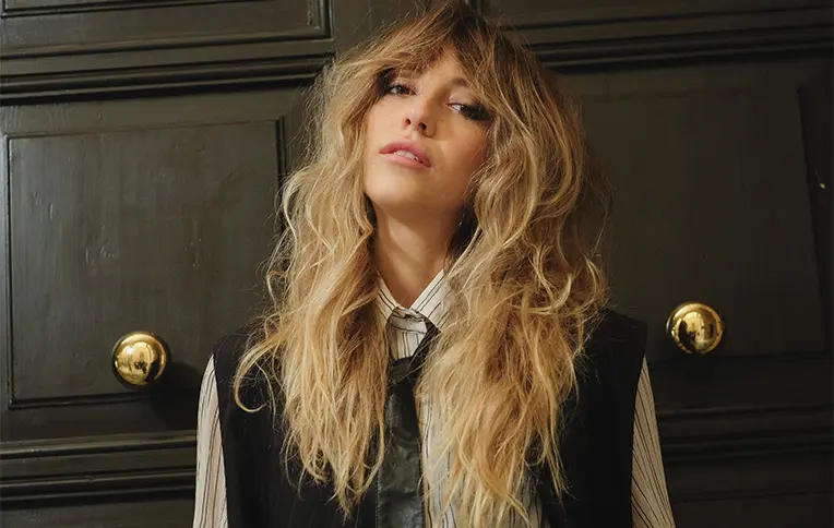 Blonde girl with wavy, voluminous hair