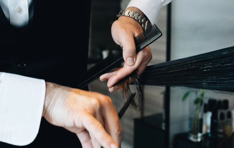 Hairstylist cutting a client's hair