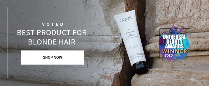 Splendido shampoo, voted best hair product for blonde hair in white bottle and black lid