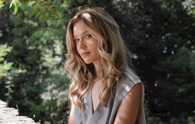 girl with long, wavy blonde hair.