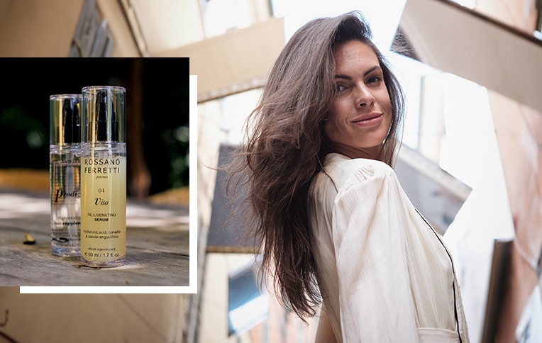 Image of a brunette woman with long hair next to an image of Rossano Ferretti Parma's Vita rejuvenating serum and Prodigio regenerating oil.