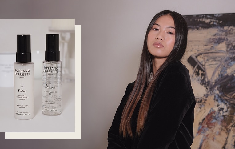 Immagine di una ragazza asiatica con lunghi capelli scuri, accanto ai prodotti di Rossano Ferretti Parma. Il siero lisciante Velluto e l'olio protettivo e luminositá Brillante.