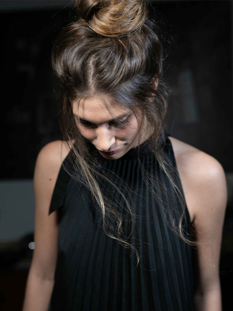 Image of a girl with a messy chignon.