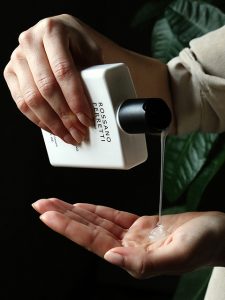 Image of shampoo being poured into a hand.