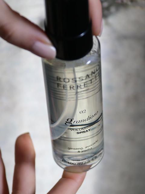 Image of a model holding Rossano Ferretti Parma's Grandioso Volumizing Spray