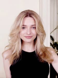 Girl with long, wavy blonde hair.